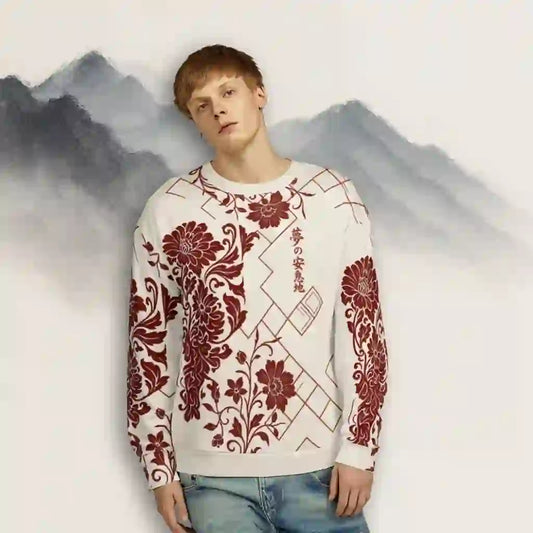 Male model wearing a white sweatshirt with a red floral and geometric print, standing against an artistic mountain backdrop. Shows the sweatshirt's fit and lifestyle context as wearable art.