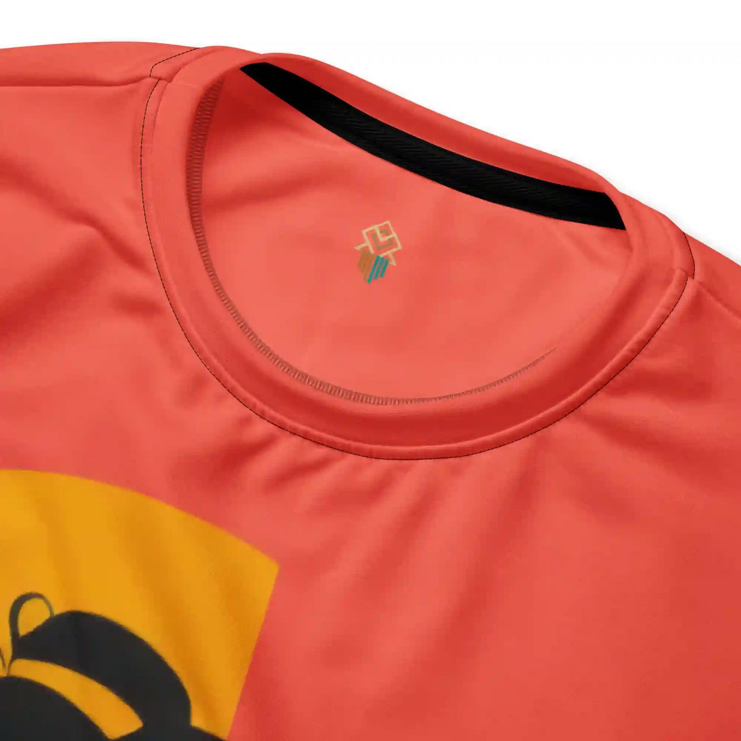 Close-up detail shot of the 'Sunset Muse' sweatshirt, highlighting the clean lines of the graphic illustration, the vibrant orange fabric, and the ribbed crew neck collar.