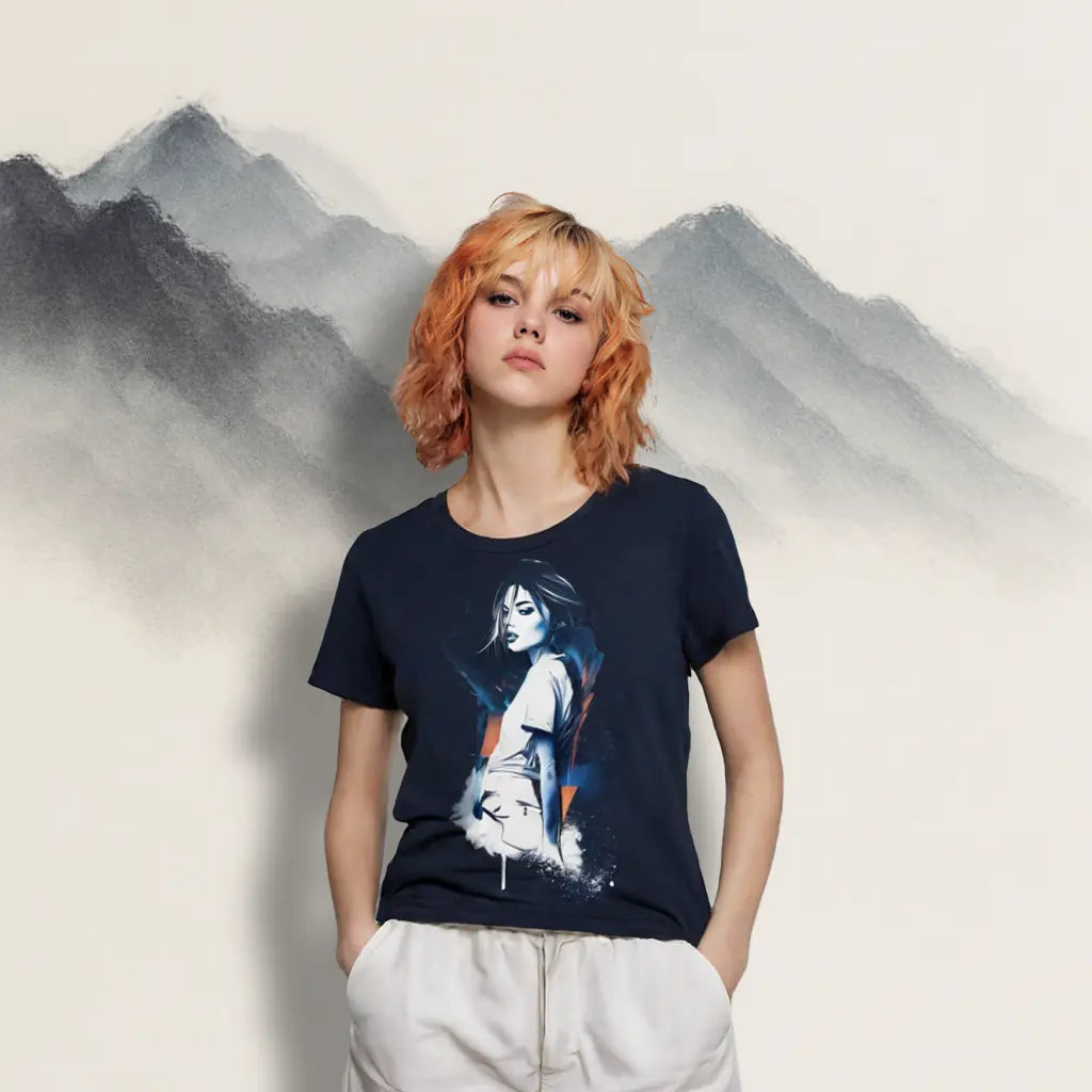Angled front view of Women's Scoop Neck T-Shirt laid flat, showing the full all-over art print of a woman looking over her shoulder against a navy blue background with abstract blue and orange splashes.