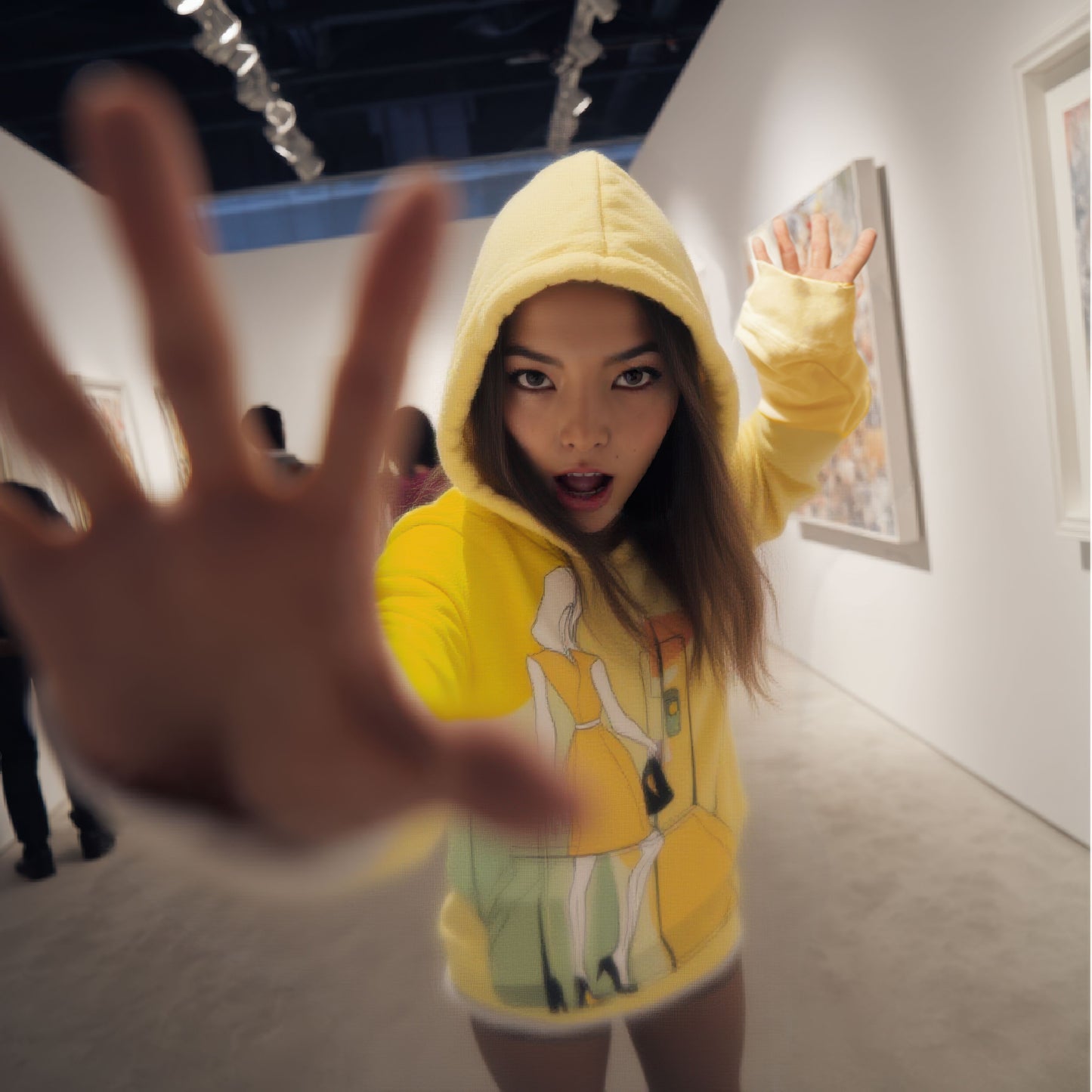 Front view of yellow green orange abstract art hoodie with fashion illustration