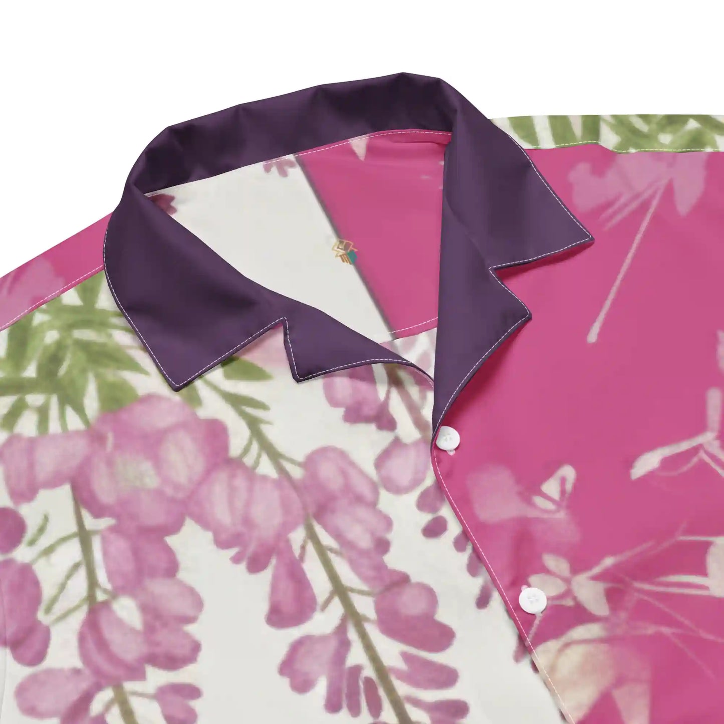 Close-up of Sakura Reverie floral button shirt collar, featuring deep plum trim and soft pink cherry blossom print.